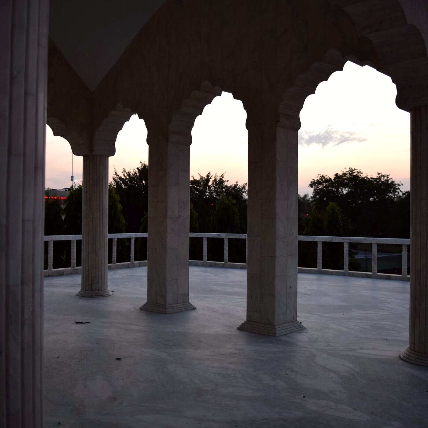 Sunset light through the columned chatri pavilion at Malhara House